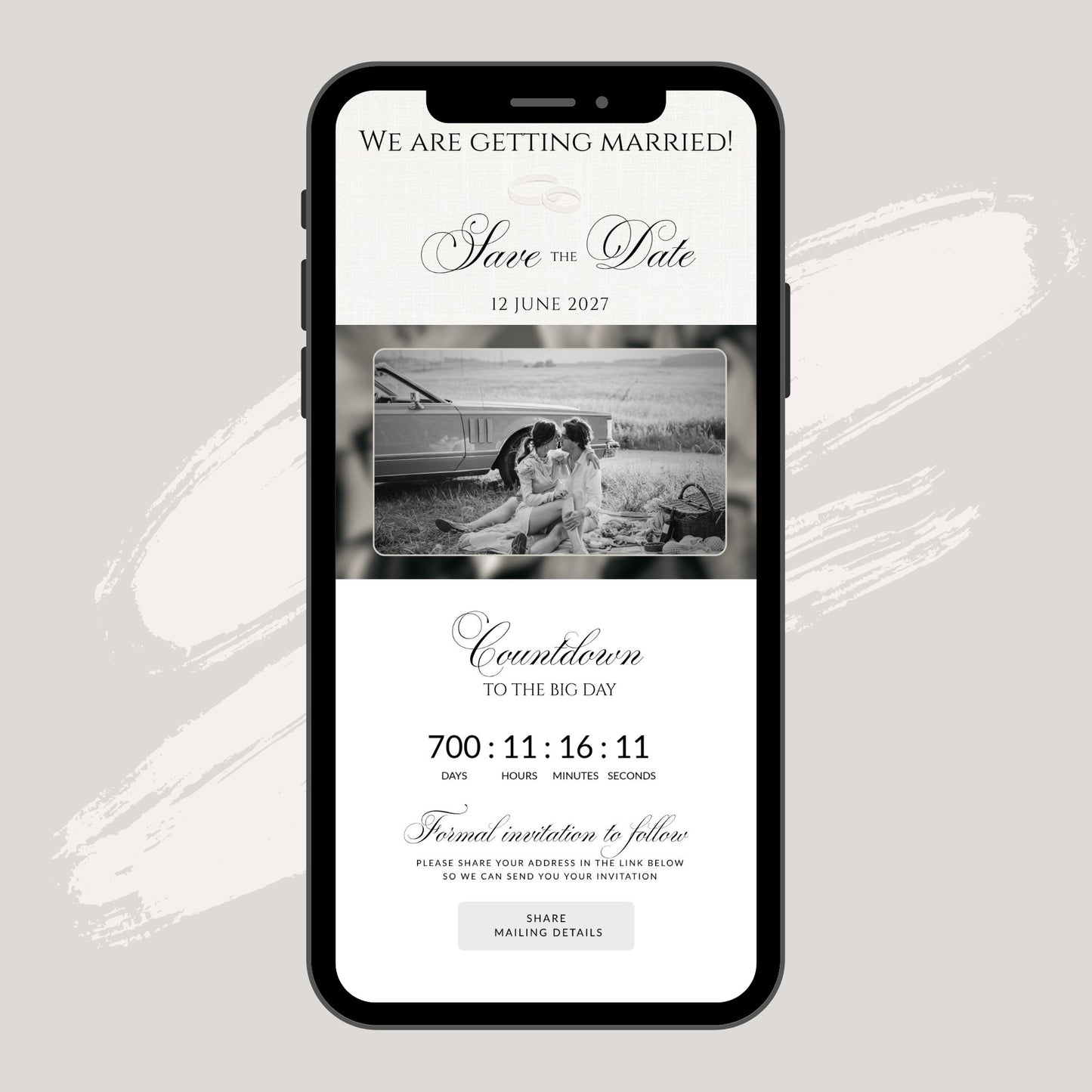 A smartphone mockup centered on a light warm-gray background, displaying a wedding save-the-date invitation design with black text, a black-and-white photo of a couple, and countdown details.