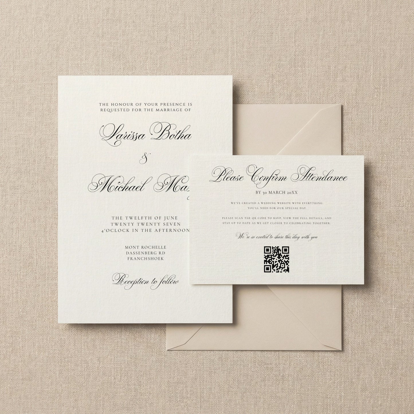 A classic wedding invitation suite featuring an off-white main invitation card, a smaller confirmation card with a QR code, and two matching envelopes, arranged on a textured beige fabric background.